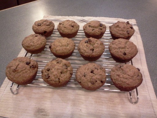 Photo of twelve muffins on a cooking rack.
